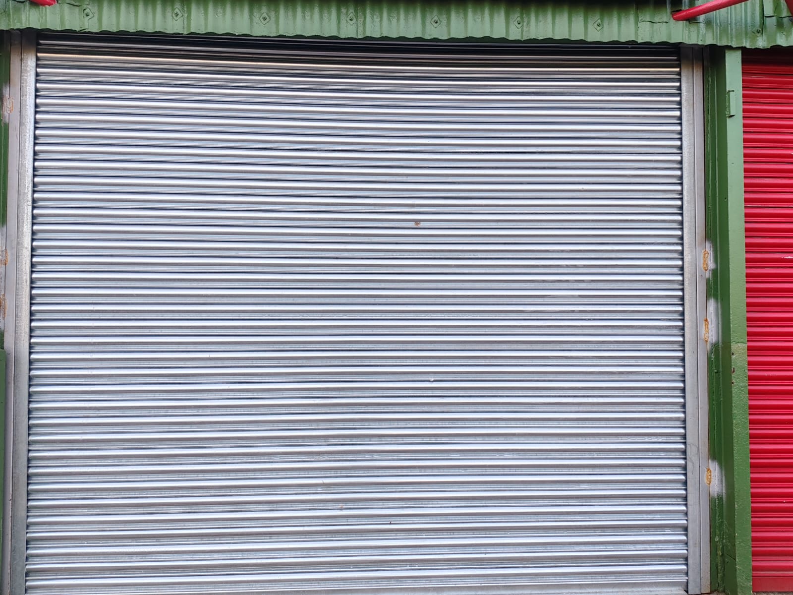 Nurse administering roller shutter installation in London